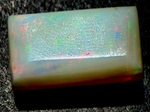 Brightly colored Coober Pedy white, precious opal